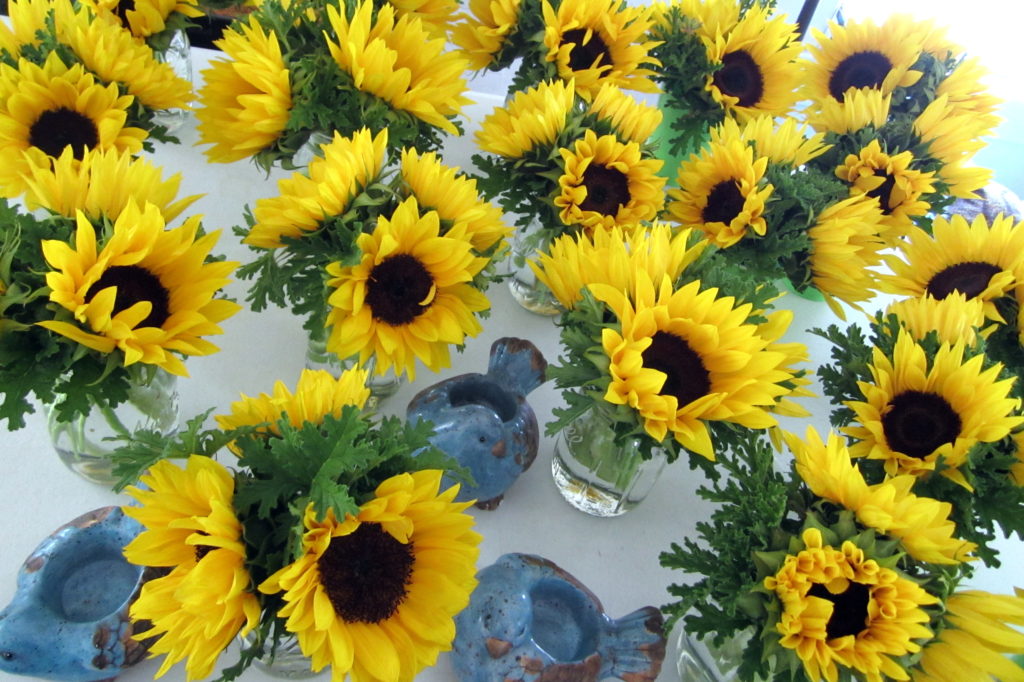 sunflowers with votive blue birds